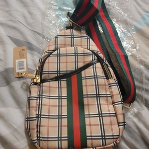 Boutique style backpack/shoulder sling. Non branded.